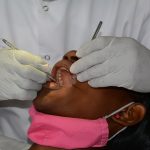 A dentist working on a girl