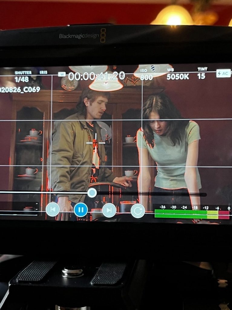 Ceyda and Grayson filming a scene.