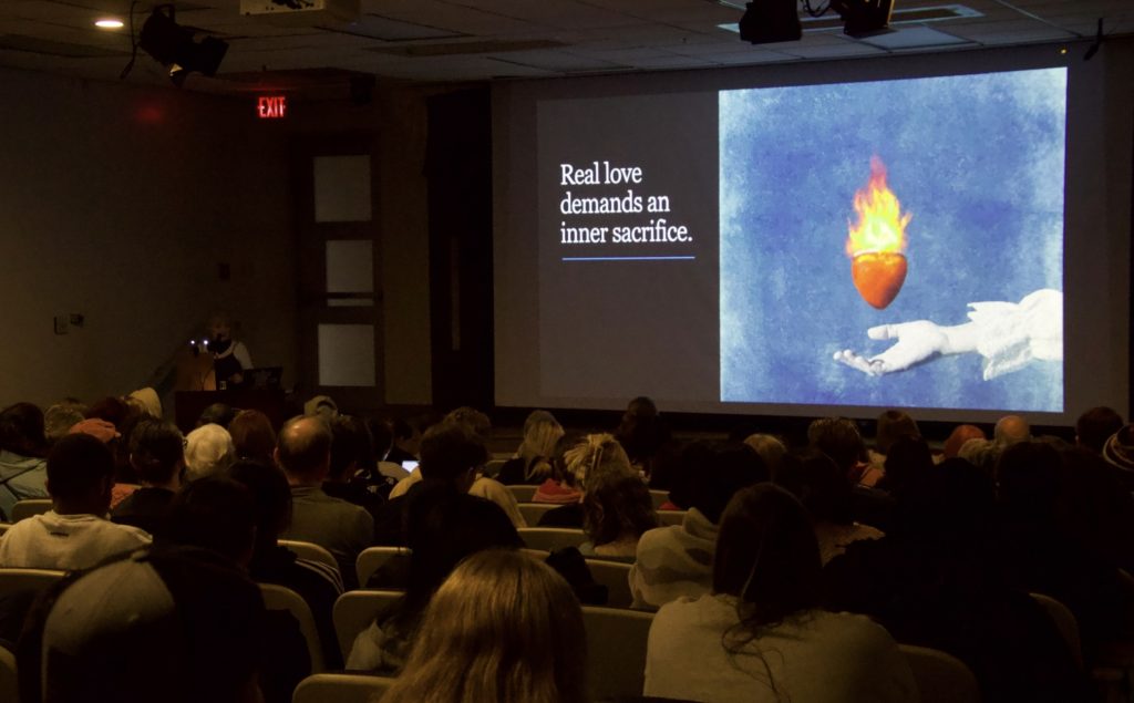 Photo of a PowerPoint slide that says "Real love demands an inner sacrifice."