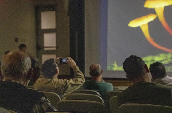 Observers watch presentation on macro-photography held in L. J. Goins building at Pellissippi's Hardin Valley campus.